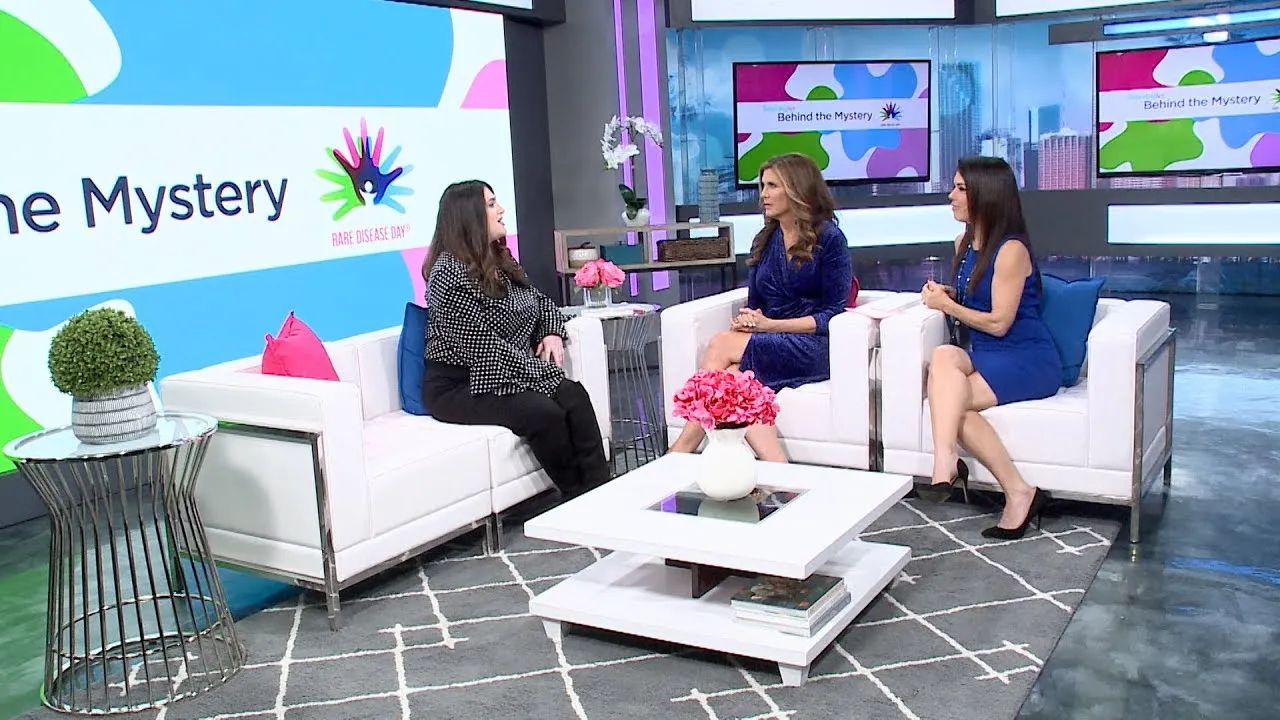 Three women seated in a studio, engaged in a discussion about rare disease day.