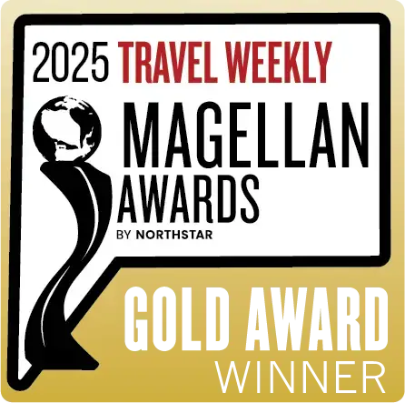 An official award seal for the "2025 Travel Weekly Magellan Awards by Northstar". The graphic features a stylized black trophy silhouette topped with a globe on a white and gold background. Large text at the bottom identifies the recipient as a "Gold Award Winner".